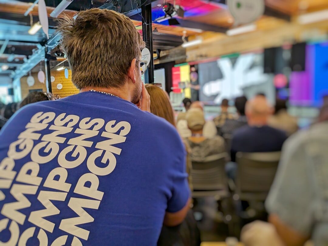 Production crew setting up livestream equipment at a corporate event