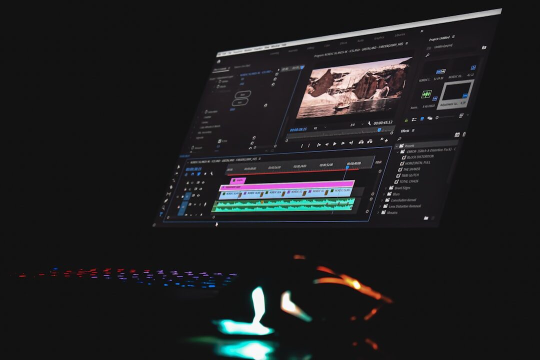 Video editor working on a laptop with live streaming software