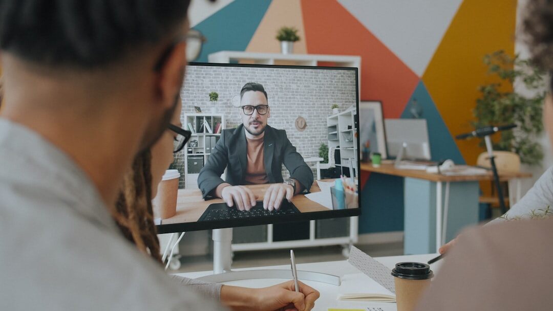 Grid of remote speakers on a video conference screen during a live event
